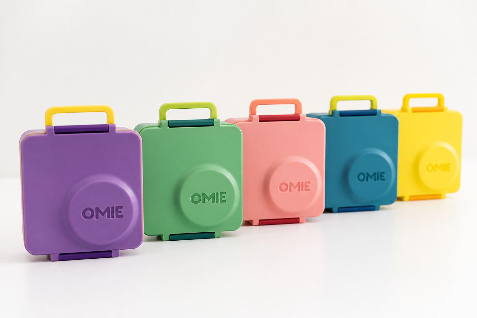 All five colorful Bento Box variants lined up in a row on a clean white surface showing purple green pink blue and yellow options