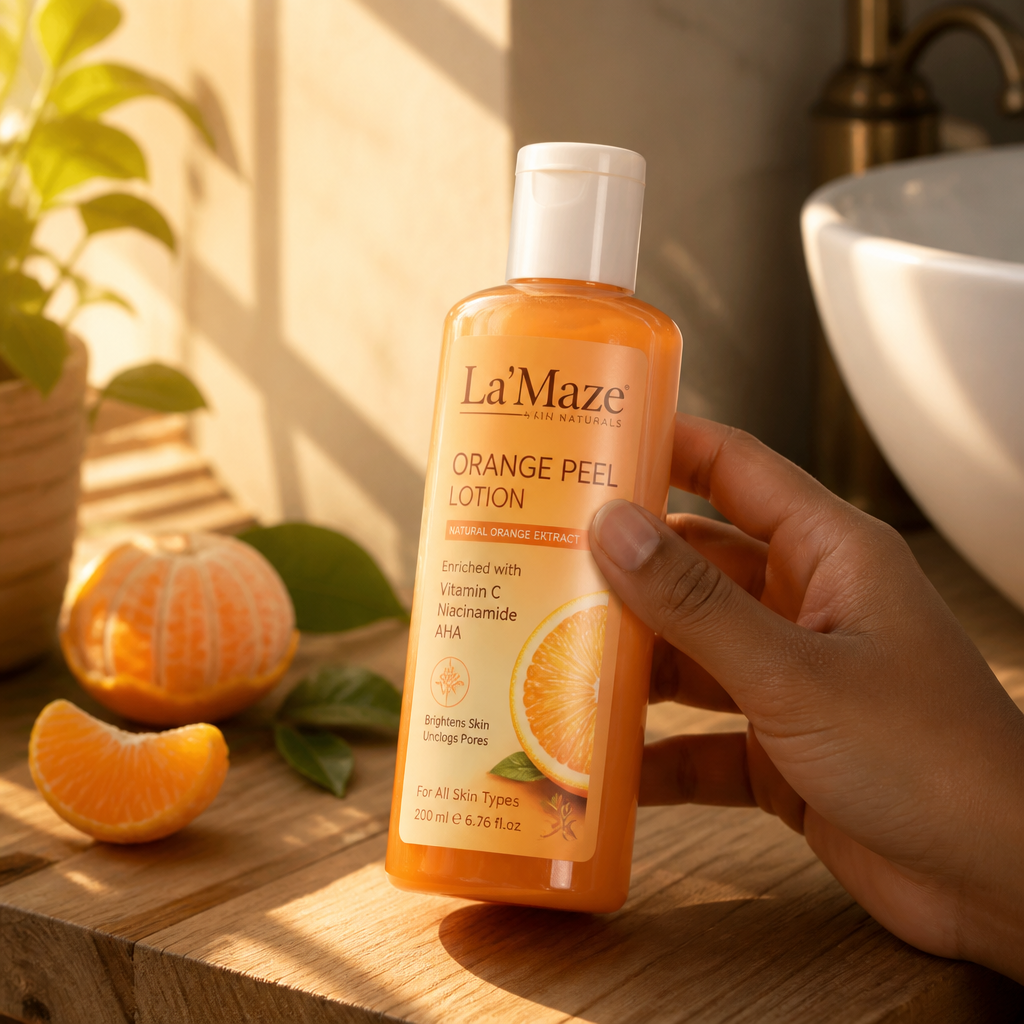 La'Maze orange peel lotion bottle displayed on a soft cream towel with a glowing bare arm bathed in soft natural light
