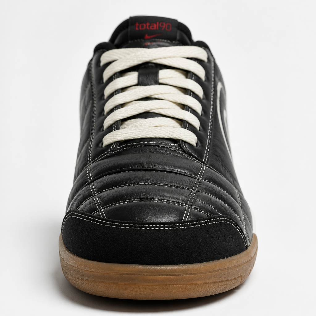 Front view of Nike sneaker showing toe box and laces in crisp white on clean background