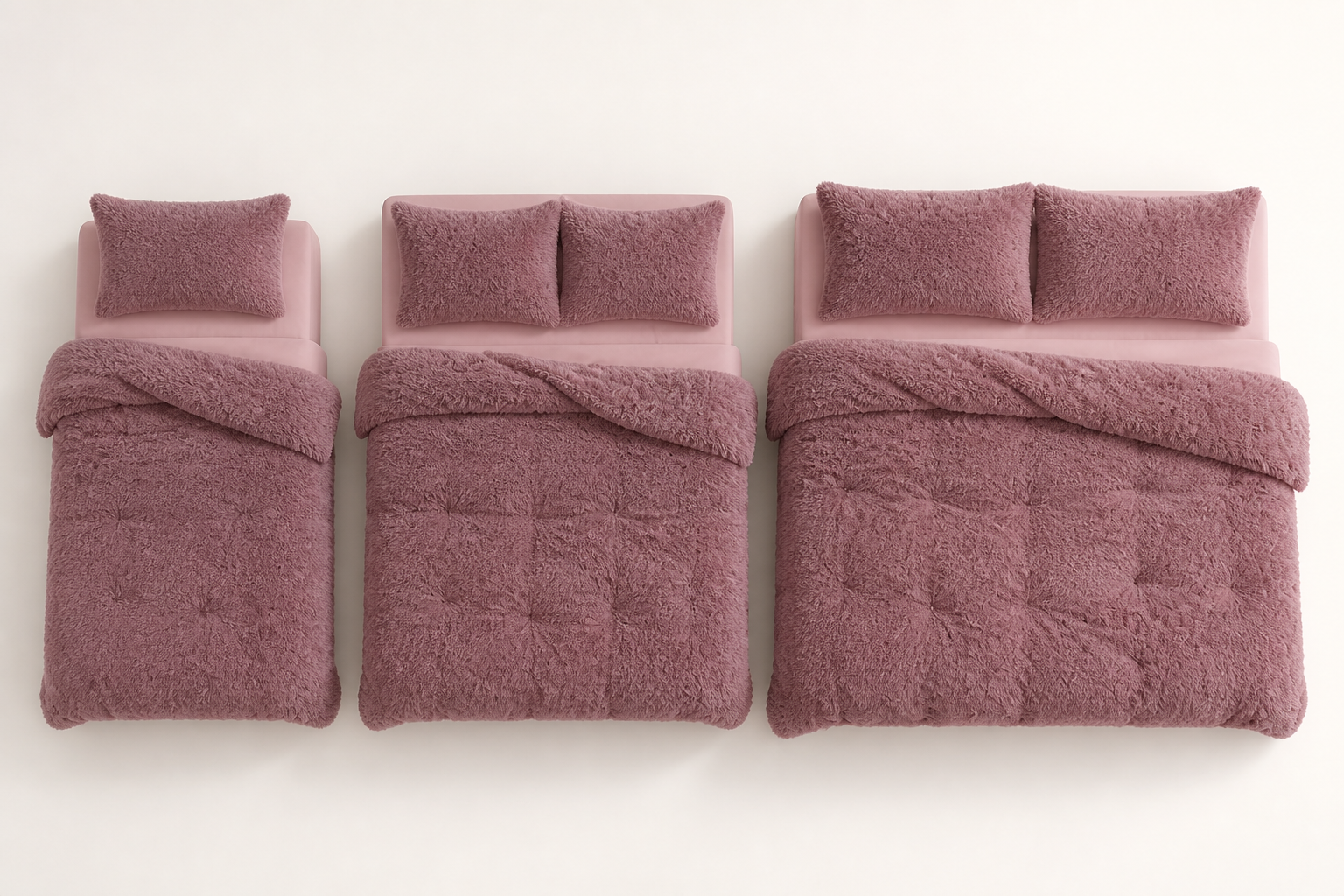Top-down view of three beds (single, queen, king) with the matching fleece set on each, showing the size difference clearly from above with neat styling
