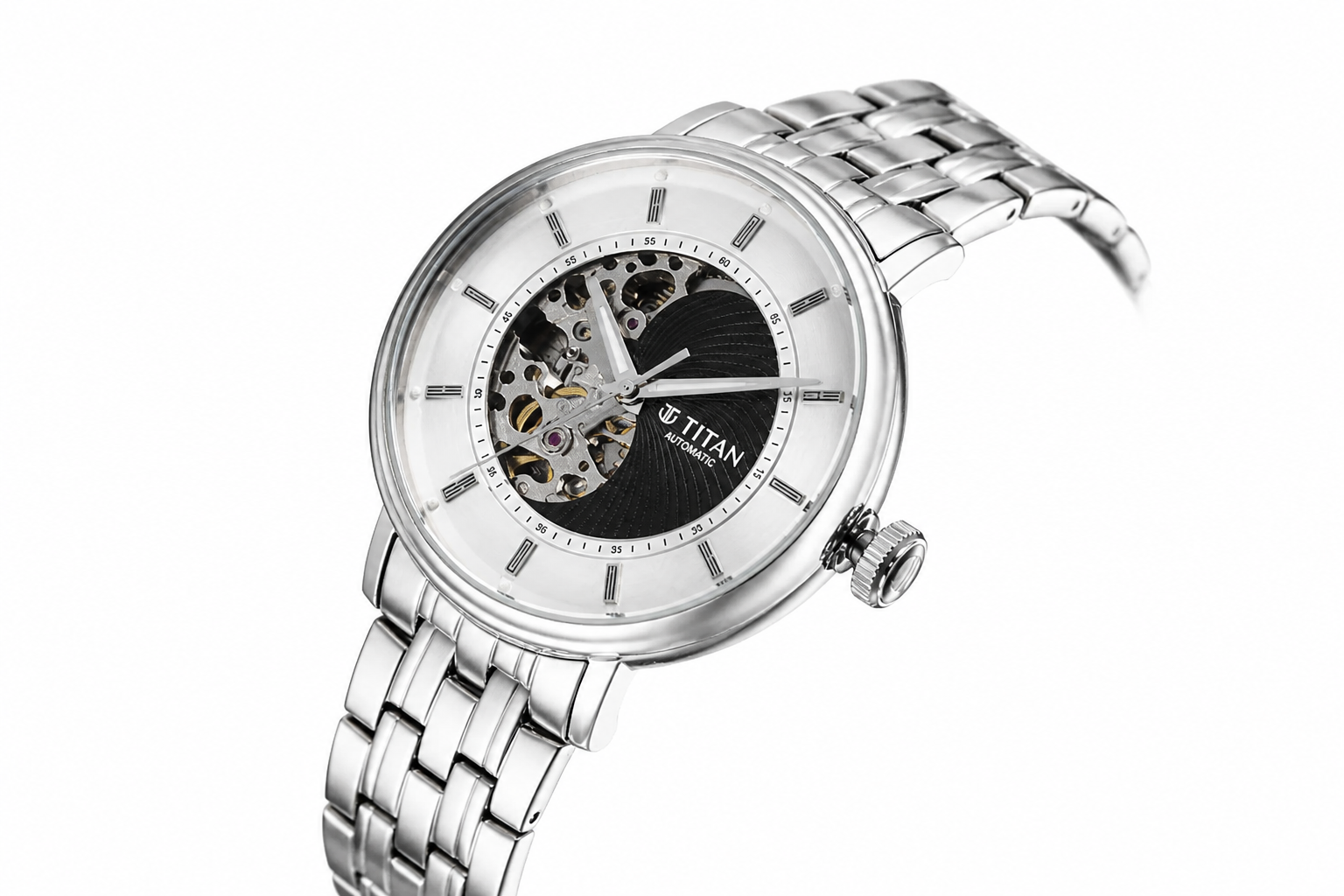 Close-up product shot of the Titan Yin-Yang Skeletal Automatic floating on soft diffused light, angled to reveal both the open skeletal dial and the polished stainless steel bracelet links