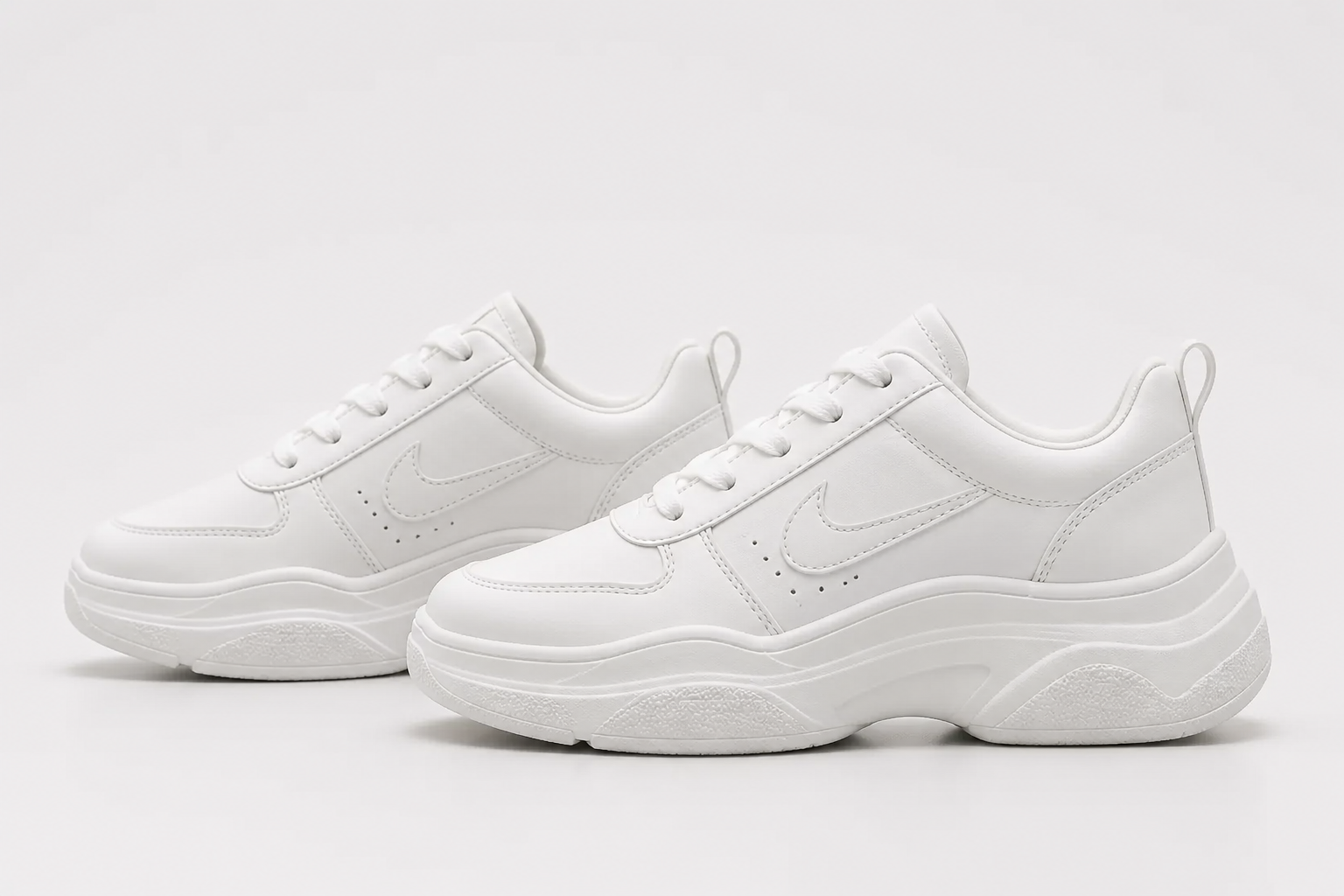 Clean studio product shot of Nike Sneakers 3 from the side angle on a white seamless background, showing the iconic Nike swoosh logo and sleek curved silhouette with sharp focus