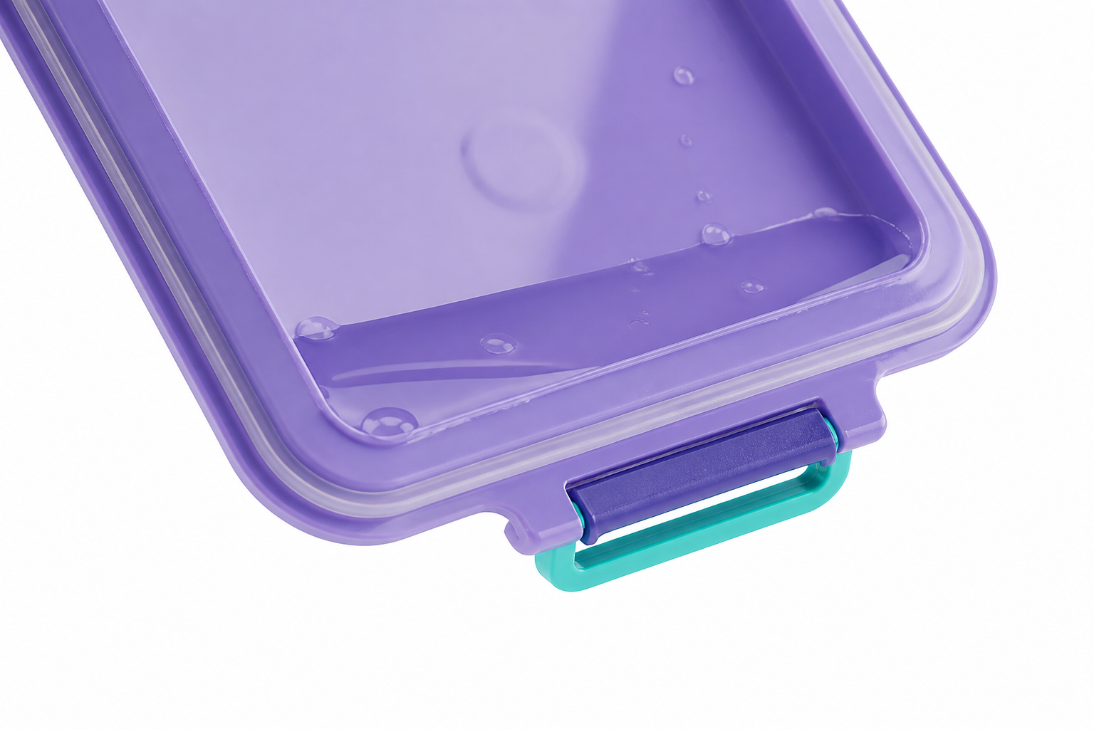 Macro shot of the leakproof silicone seal and secure latches on the Bento Box lid being tested upside down with water inside to demonstrate zero leak guarantee