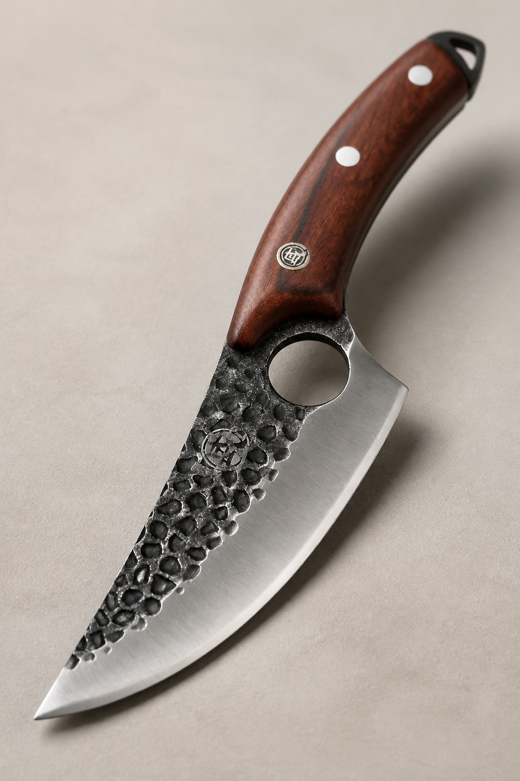 Professional bone-cutting knife with stainless steel blade and ergonomic wooden handle, displayed at dramatic angle