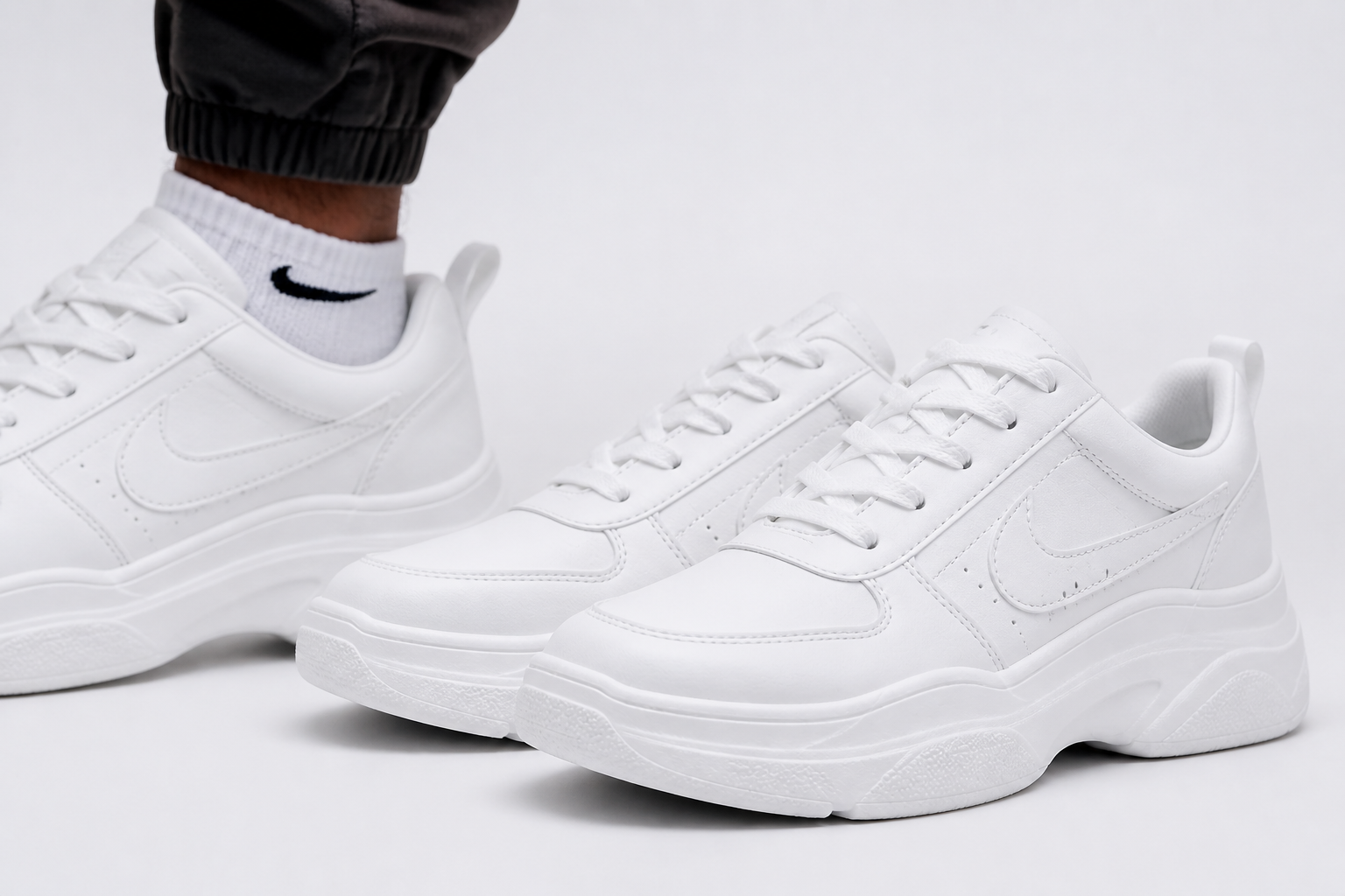 A fresh pair of Nike Sneakers 3 on a clean white background showing the iconic swoosh logo and crisp white design