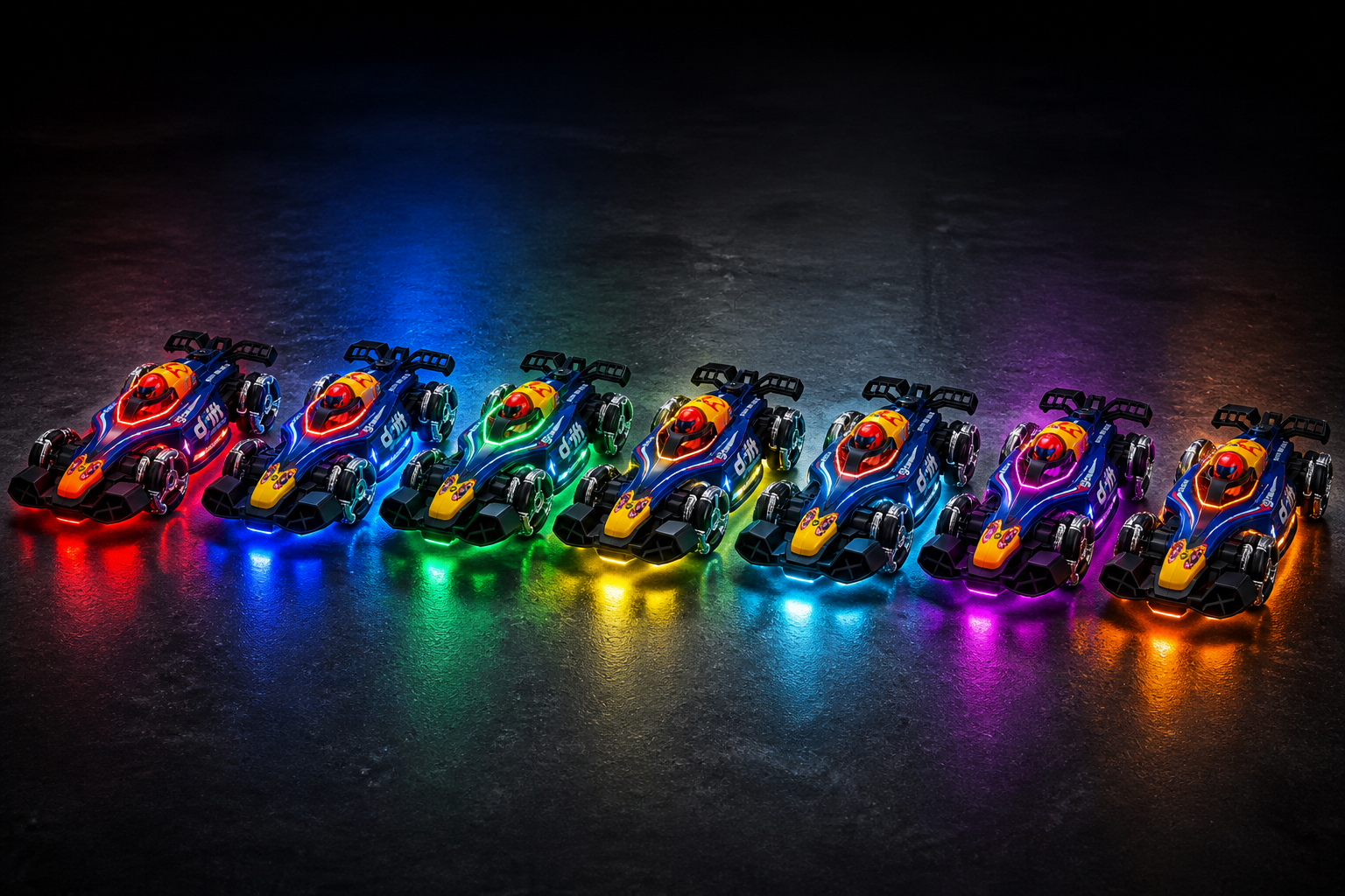 Wide lineup of all 7 GRAPHENE RC car variants arranged in a row on a dark studio floor, each with RGB underglow lights glowing in red, blue, green and yellow creating a colorful spectrum