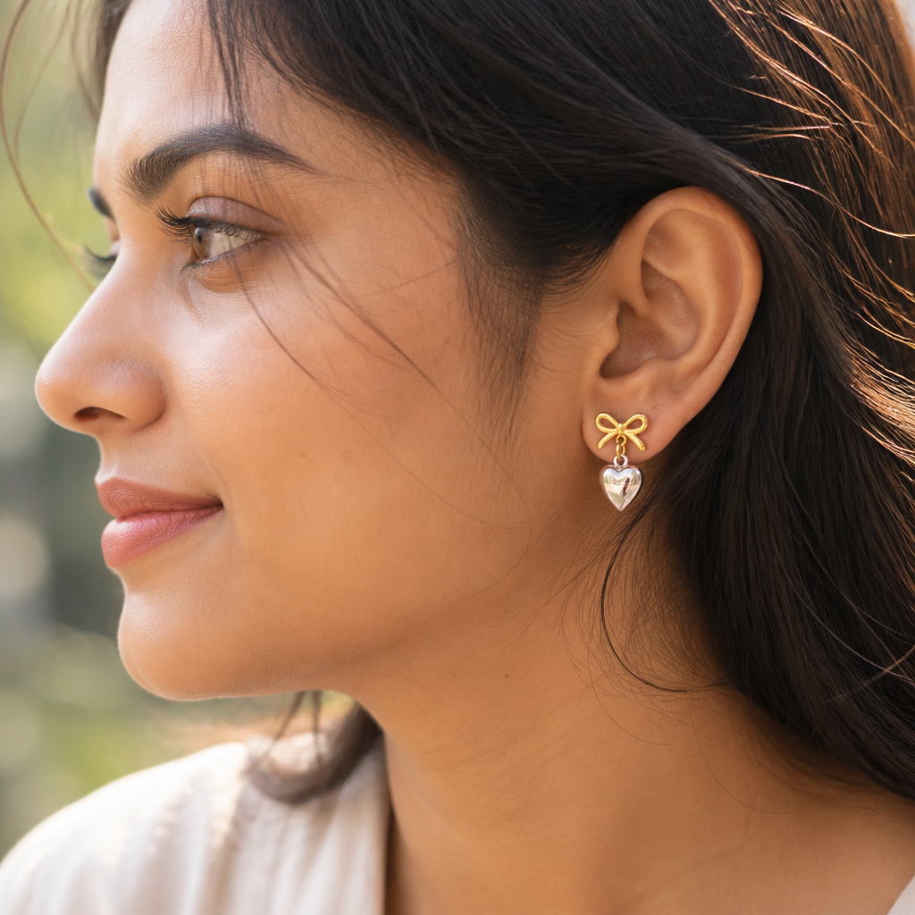 Love Heart Earrings thumbnail styled on ear with delicate light catching