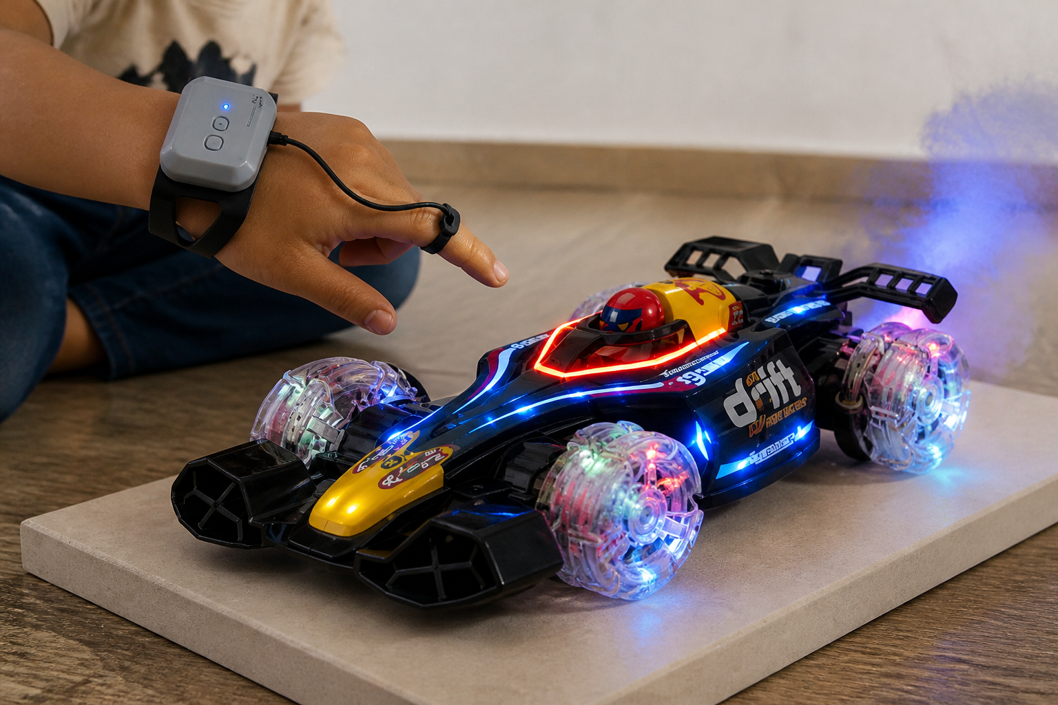 A close-up of a child's open hand hovering above the GRAPHENE sensor module as the small toy car follows the gesture on a glossy showroom floor