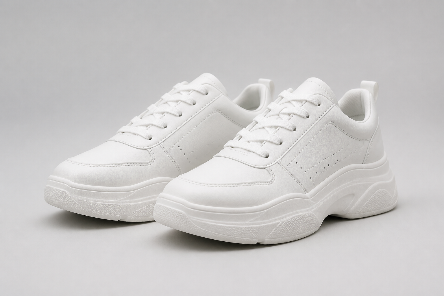 Side-by-side image of a generic unbranded white sneaker with thick bulky sole on plain background representing the ordinary competitor option