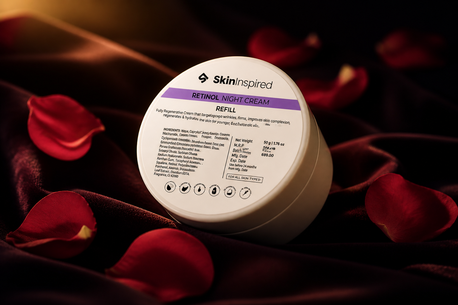 Dramatic end-page shot of a single luxurious 50g cream jar glowing in soft warm spotlight on a dark velvet surface with rose petals scattered around