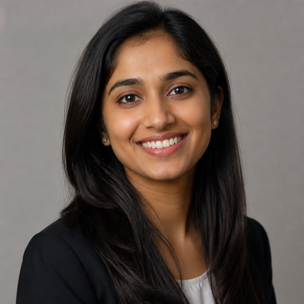 Cheerful Indian woman with shoulder-length hair laughing softly, warm window light, candid close-up portrait, natural makeup, gentle bokeh background