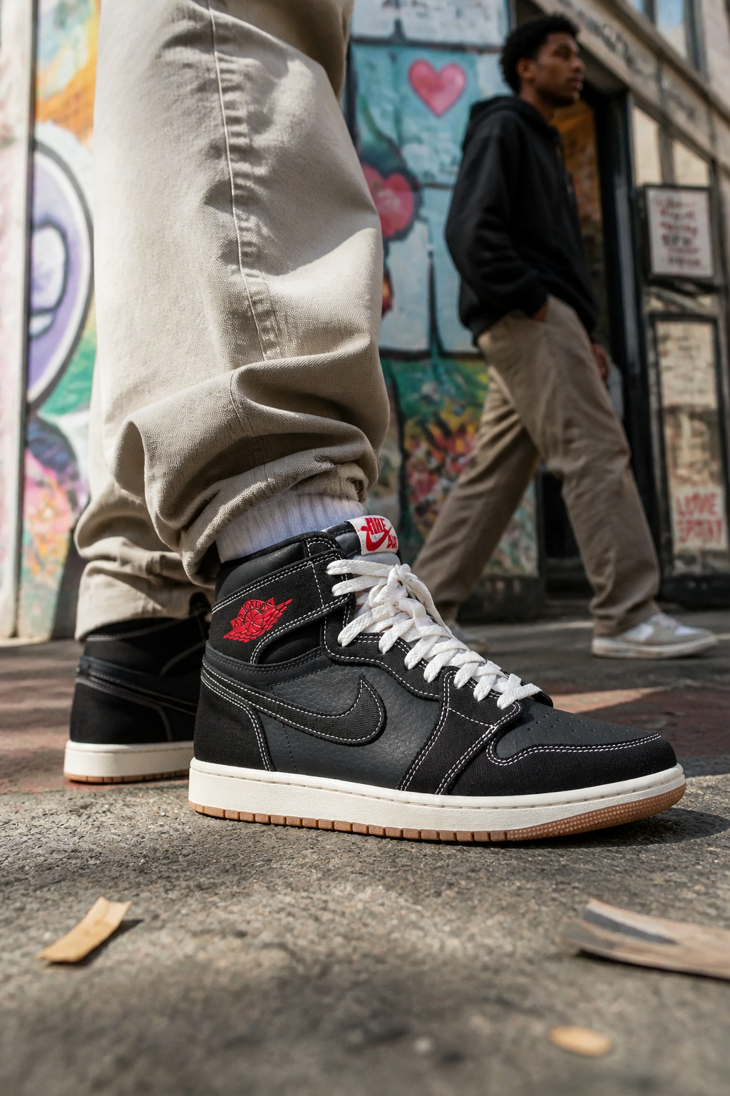 Fashion-forward urban explorer wearing Nike Total 90 Premium sneakers traversing creative street art neighborhood with colorful murals