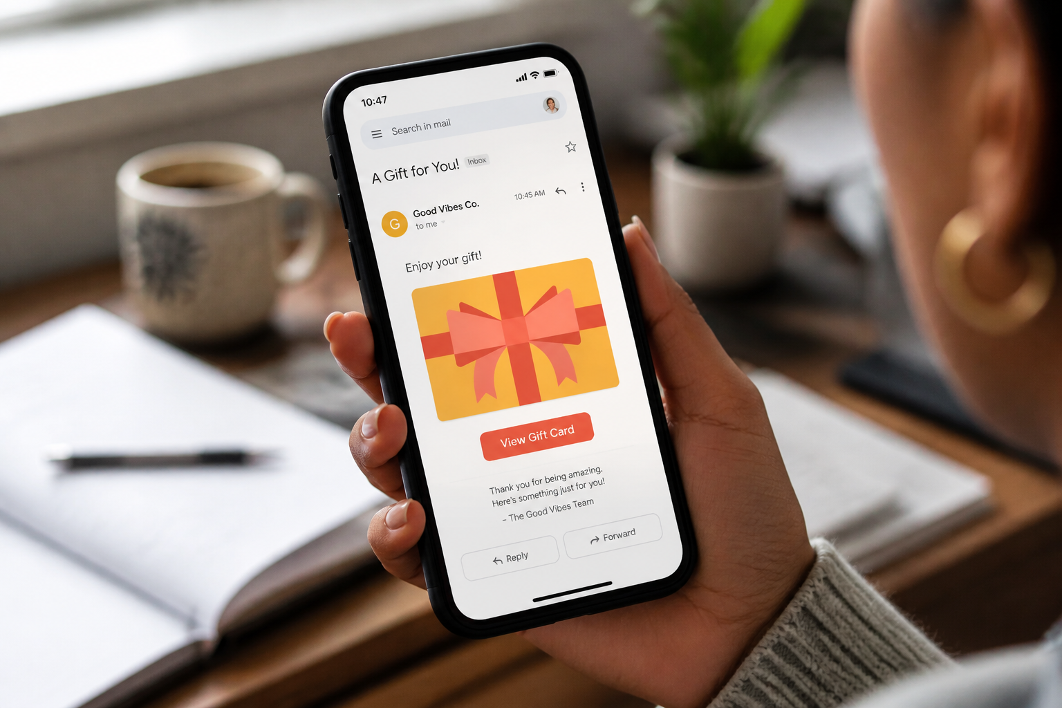 An elegant email arriving in an inbox on a smartphone with a beautifully designed gift card preview