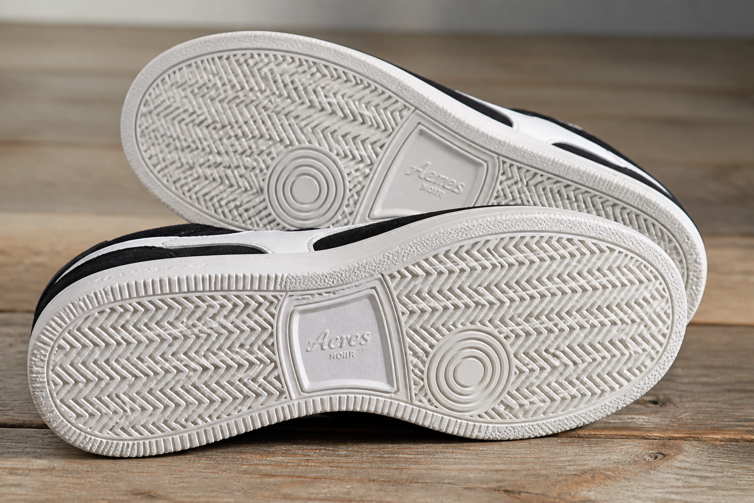 Close-up of 100% pure white rubber sole grip pattern on Aeres NOIR sneaker showing dense tread texture