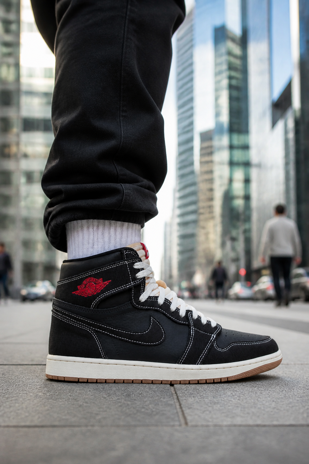 Stylish young professional wearing Nike Total 90 Premium sneakers walking confidently through a modern urban district with glass skyscrapers