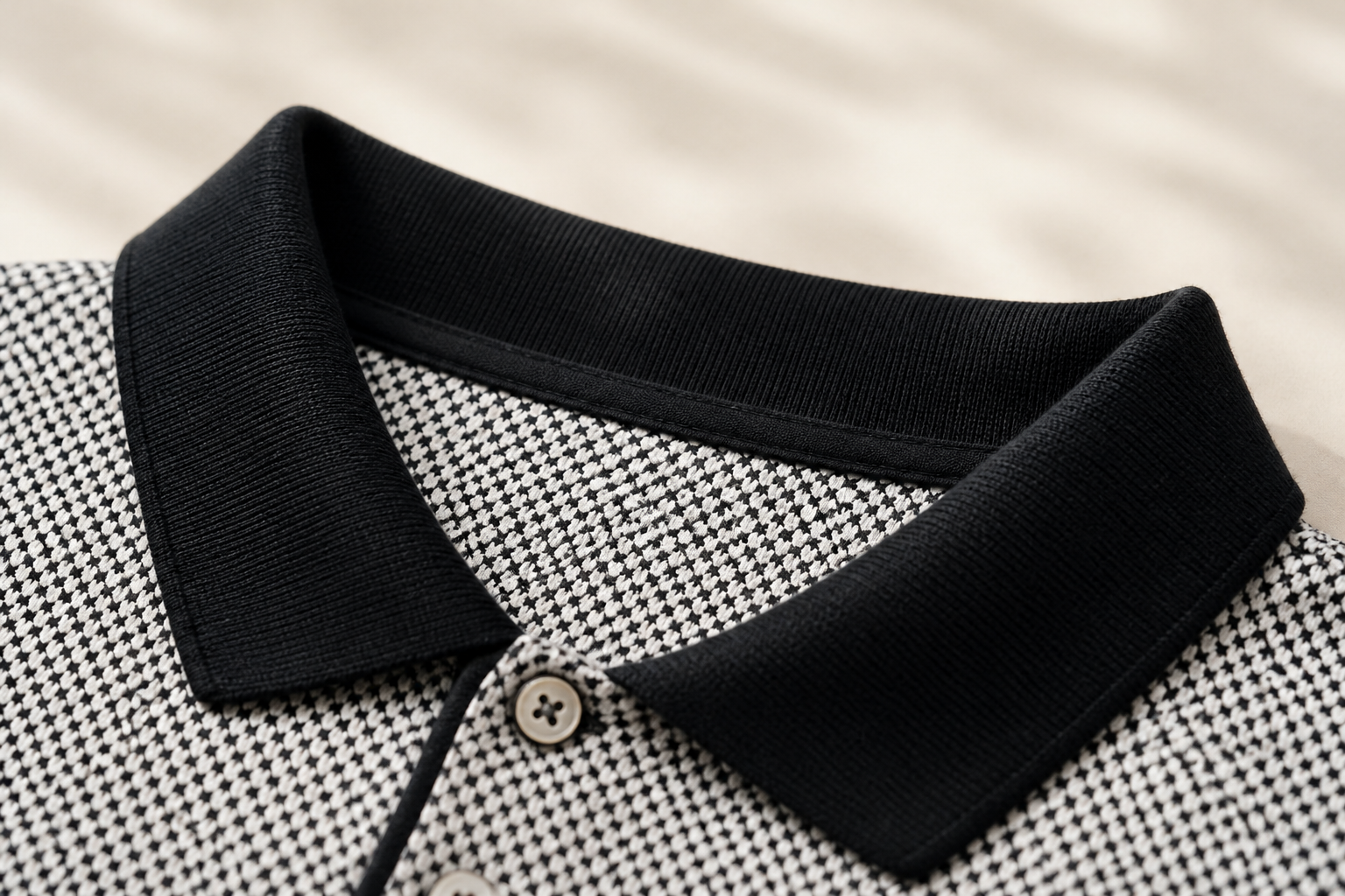 Macro detail of the structured collar holding its sharp shape against soft cream background